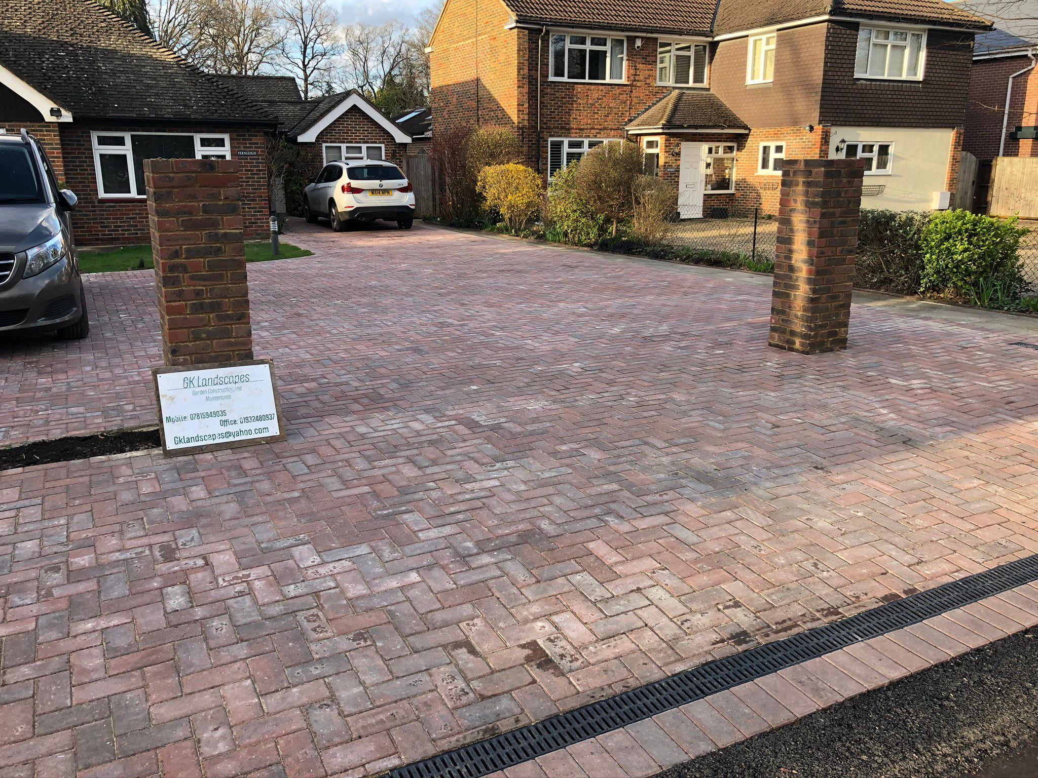 Block paving driveway with brick pillars and channel drain, Surrey