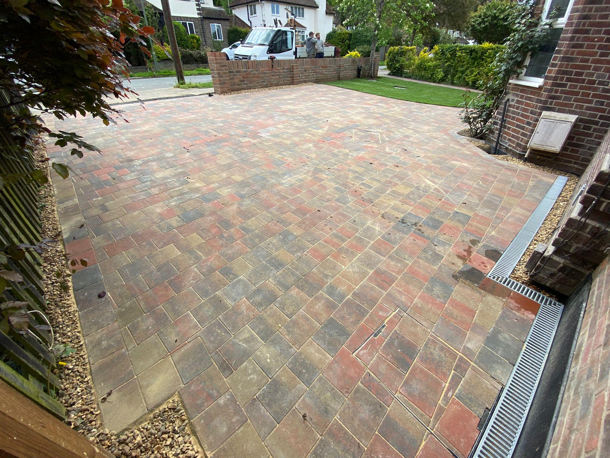 Large block paving driveway with diagonal pattern and channel drain, Surrey