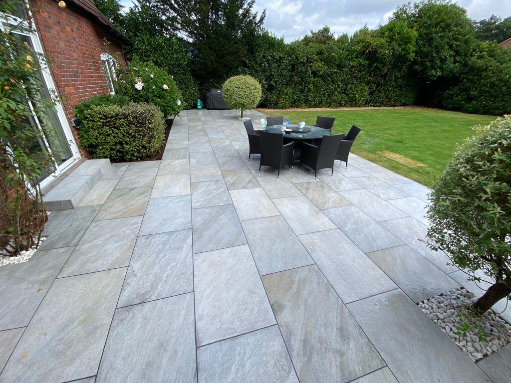 Grey porcelain patio with dining furniture Surrey