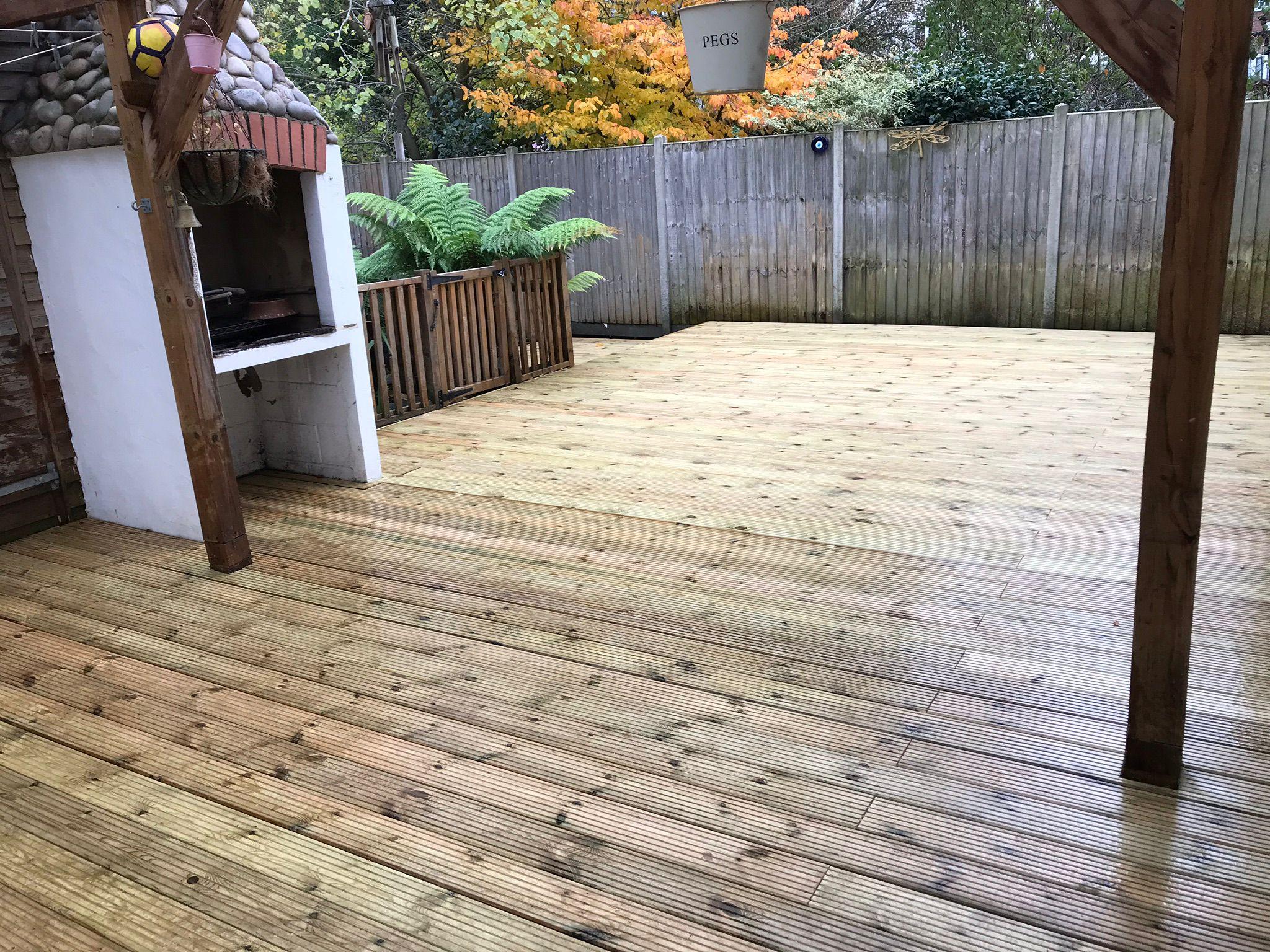 Close board fencing with timber decking Surrey